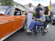 Touchmark at Fairway Village resident Layne Brannan, center, was surprised Saturday when his son-in-law Greg Sleeper showed up at the retirement community’s car show with his old whip, a Datsun 240Z. His wife Sharon Brannan, left, and daughter Brooke Sleeper, right, have fond memories of driving around in the two-seat coupe.