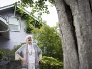 Local historian Pat Jollota admires one of the few remaining scarlet hawthorn trees on Franklin Street in the Hough neighborhood. The trees were planted in 1941 after residents formed a neighborhood group because they were upset the city knocked down older trees while widening Franklin Street. Jollota said things like the two remaining hawthorn trees and neighborhood names are important to preserve so there is a connection to local history.