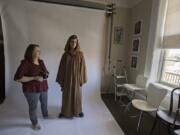 Tammy Fraley of Fraley Photography, left, shares a smile with Schuyler Smith of Vancouver as he is dressed as Obi-Wan Kenobi on Wednesday afternoon in downtown Vancouver. Fraley had previously taken Smith’s portrait and the two reunited to have their photo taken together.