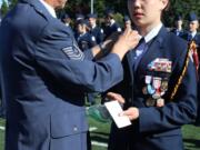 Brush Prairie: Prairie High School Air Force Junior Reserve Officer Training Corps Group Commander Cadet Lt. Col. Heather Lee receiving her new ranks from her grandfather, Master Sgt. Charles A. Bowers, who is retired from the United States Air Force.