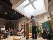 Pawneet Sethi of the Oregon &amp; Southwest Washington Sikh Community, center, speaks to the crowd at the start of the 2018 Interfaith Prayer Breakfast at St. Andrew Lutheran Church on Thursday morning, June 28, 2018.