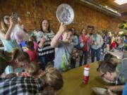 Camas resident Ryder Smith, 10, is all smiles as he wins a round of the whipped cream pie eating content during Chuck's Carnival Kid's Day at Chuck's Produce in Southeast Vancouver on Monday afternoon, June 25, 2018. The event, which was free to the public, featured a variety of games, cotton candy, snow cones, popcorn, a cupcake walk and prizes.