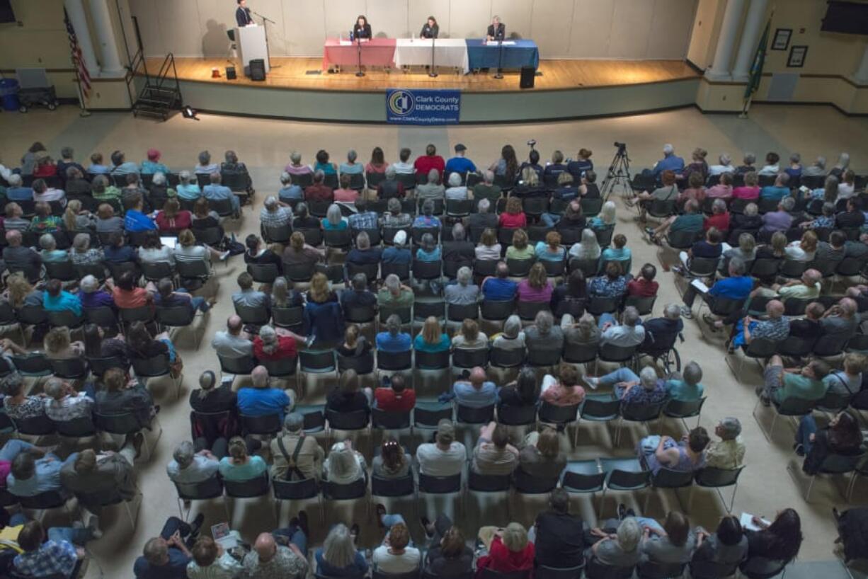 From left, candidates Dorothy Gasque, Carolyn Long and David McDevitt considered immigration, climate change and the economy during a 3rd Congressional District Candidate forum hosted by Clark County Democrats at Thomas Jefferson Middle School on Tuesday.