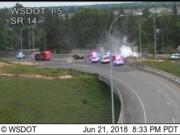 Smoke billows from a minivan, shown here in a still from a Washington State Department of Transportation traffic camera, that was subject of a Thursday evening police pursuit from Cowlitz County to downtown Vancouver.