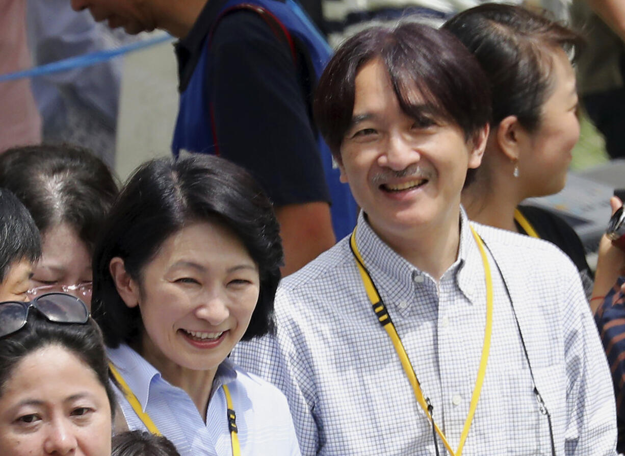 FILE - In this Saturday, May 19, 2018, file photo, Japan's Prince Akishino and Princess Kiko watch as Prince Hisahito participates in a sports event at a primary school affiliated with Ochanomizu University in Tokyo. Prince Akishino, the second son of Japan's Emperor Akihito, and his wife, Princess Kiko, are visiting Hawaii for the first time. The Japanese royal couple is on Oahu from June 4 to June 8, 2018, as part of a yearlong celebration for the 150th anniversary of the first Japanese immigrants arriving in Hawaii. They will visit the National Cemetery of the Pacific in Punchbowl and the Ehime Maru Memorial on Monday, which commemorates Japanese lives lost when a U.S. submarine collided with a Japanese ship, and attend dinner with Gov. David Ige.