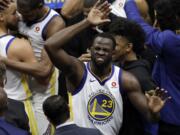 Golden State Warriors' Draymond Green celebrates after Game 3 of basketball's NBA Finals, Wednesday against the Cleveland Cavaliers, June 6, 2018, in Cleveland. The Warriors defeated the Cavaliers 110-102 to take a 3-0 lead in the series.