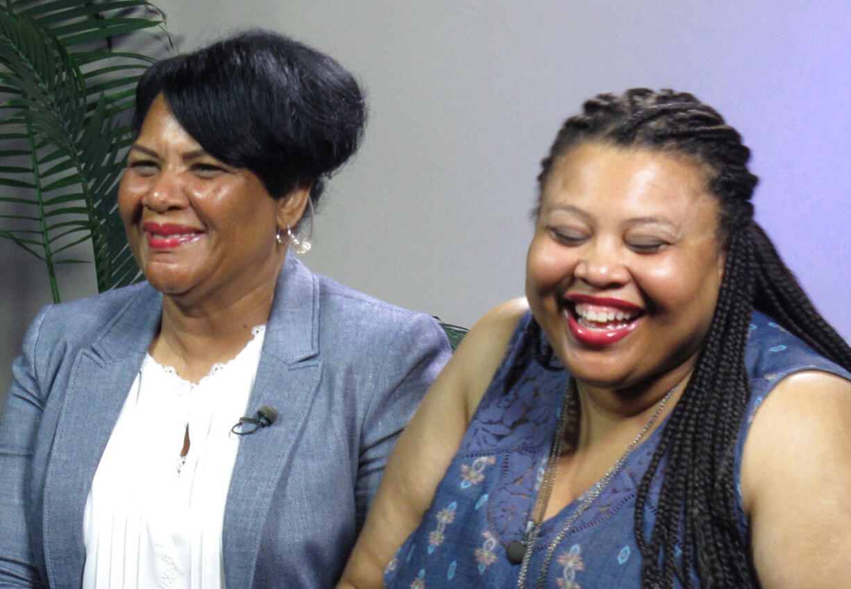 Alice Marie Johnson, left, and her daughter Katina Marie Scales wait to start a TV interview on Thursday, June 7, 2018 in Memphis, Tenn. Johnson, 63, whose life sentence was commuted by President Donald Trump thanked him on Thursday for "having mercy" and said reality TV star Kim Kardashian West saved her life.