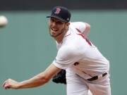 Boston Red Sox starting pitcher Chris Sale delivers against the Seattle Mariners during the first inning of a baseball game at Fenway Park in Boston Sunday, June 24, 2018.