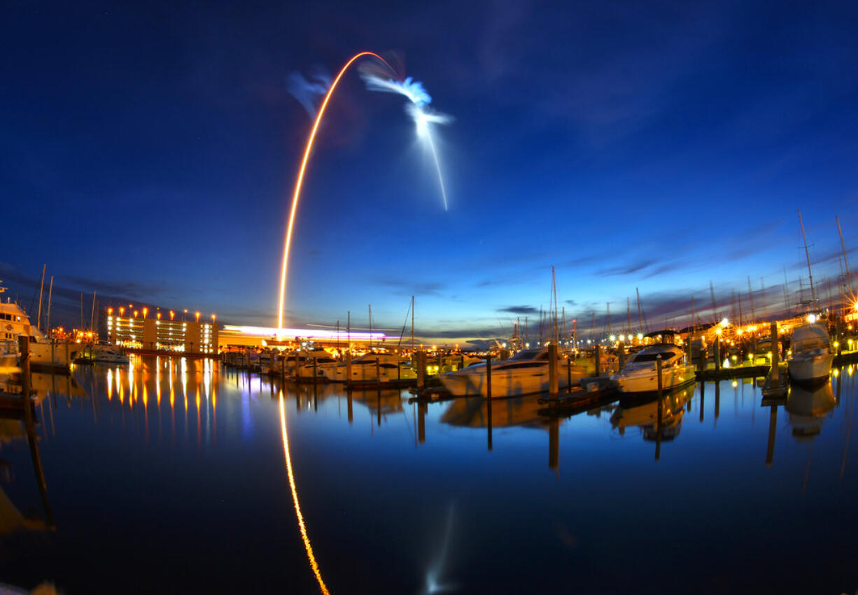 A SpaceX Falcon 9  rocket's exhaust plume is illuminated during a launch just before dawn Friday, June 29, 2018 at Launch Complex 40 at Cape Canaveral, Fla.   The used Falcon rocket blasted off before dawn, hauling nearly 6,000 pounds (2,700 kilograms) of cargo, including the spherical AI bot named Cimon; genetically identical mice, or mousetronauts; and super-caffeinated coffee for the crew of the International Space Station. The shipment, packed into a Dragon capsule that's also recycled, should reach the station Monday.