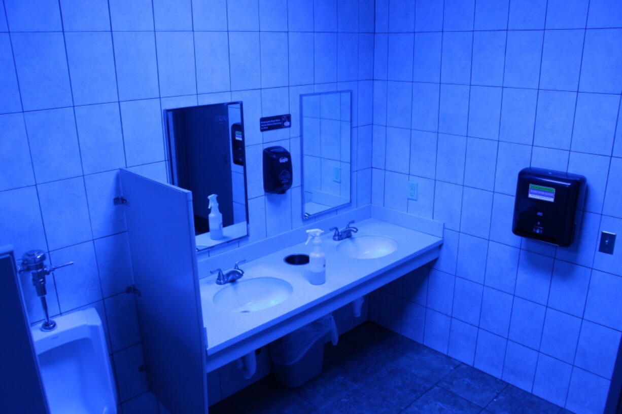 A public bathroom bathed in blue light is seen at this Turkey Hill convenience store on Friday in Wilkes-Barre, Pa.