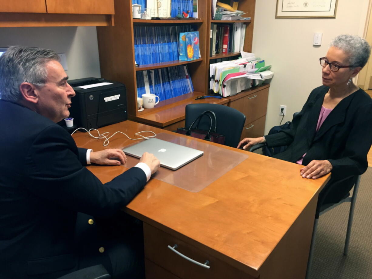 Adine Usher, 78, meets May 24 with breast cancer study leader Dr. Joseph Sparano at the Montefiore and Albert Einstein College of Medicine in the Bronx borough of New York. Usher was one of about 10,000 participants in the study which shows women at low or intermediate risk for breast cancer recurrence may safely skip chemotherapy without hurting their chances of survival.