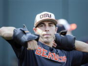 Oregon State pitcher Luke Heimlich works with weights during practice at TD Ameritrade Park in Omaha, Neb., Friday, June 15, 2018. Oregon State plays North Carolina on Saturday in the NCAA College World Series baseball tournament..