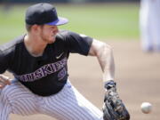 Washington third baseman Willie MacIver (9) fields a ground ball during practice at TD Ameritrade Park in Omaha, Neb., Friday, June 15, 2018. Washington plays Mississippi State on Saturday in the NCAA College World Series baseball tournament..