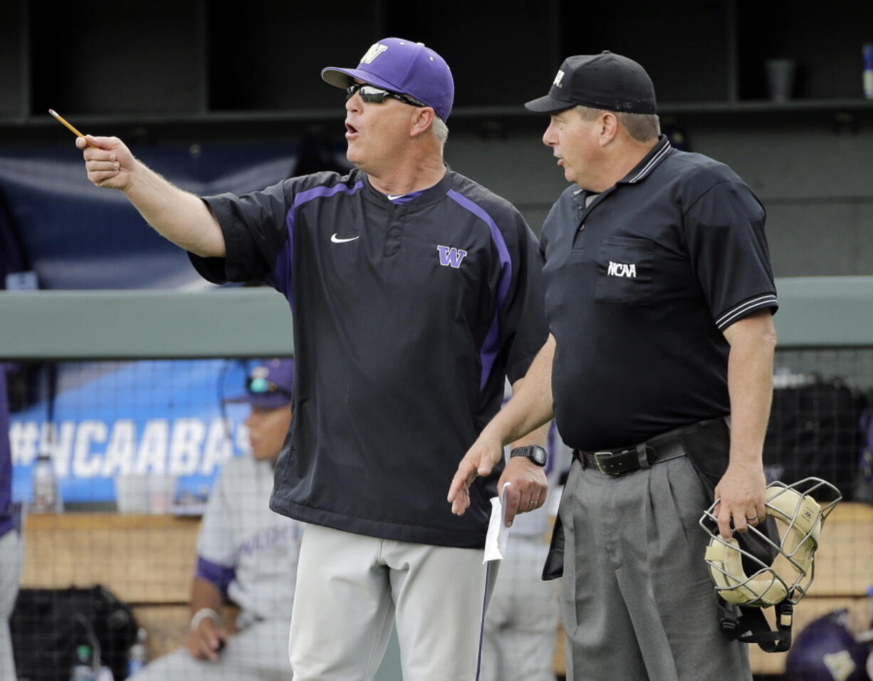 FILE - In this June 3, 2016, file photo, Washington head coach Lindsay Meggs, left, argues a call with home plate umpire David Savage during an NCAA college baseball regional tournament game against UC Santa Barbara in Nashville, Tenn. On Saturday, the Huskies face Mississippi State in the first-round of the College World Series. It’s the first trip to Omaha in Washington’s history, finally fulfilling the promise of a program that at times has featured great players and great teams, but has never put together a postseason run good enough to find its way to the CWS.