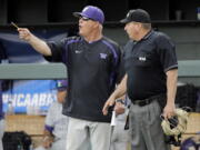 FILE - In this June 3, 2016, file photo, Washington head coach Lindsay Meggs, left, argues a call with home plate umpire David Savage during an NCAA college baseball regional tournament game against UC Santa Barbara in Nashville, Tenn. On Saturday, the Huskies face Mississippi State in the first-round of the College World Series. It’s the first trip to Omaha in Washington’s history, finally fulfilling the promise of a program that at times has featured great players and great teams, but has never put together a postseason run good enough to find its way to the CWS.