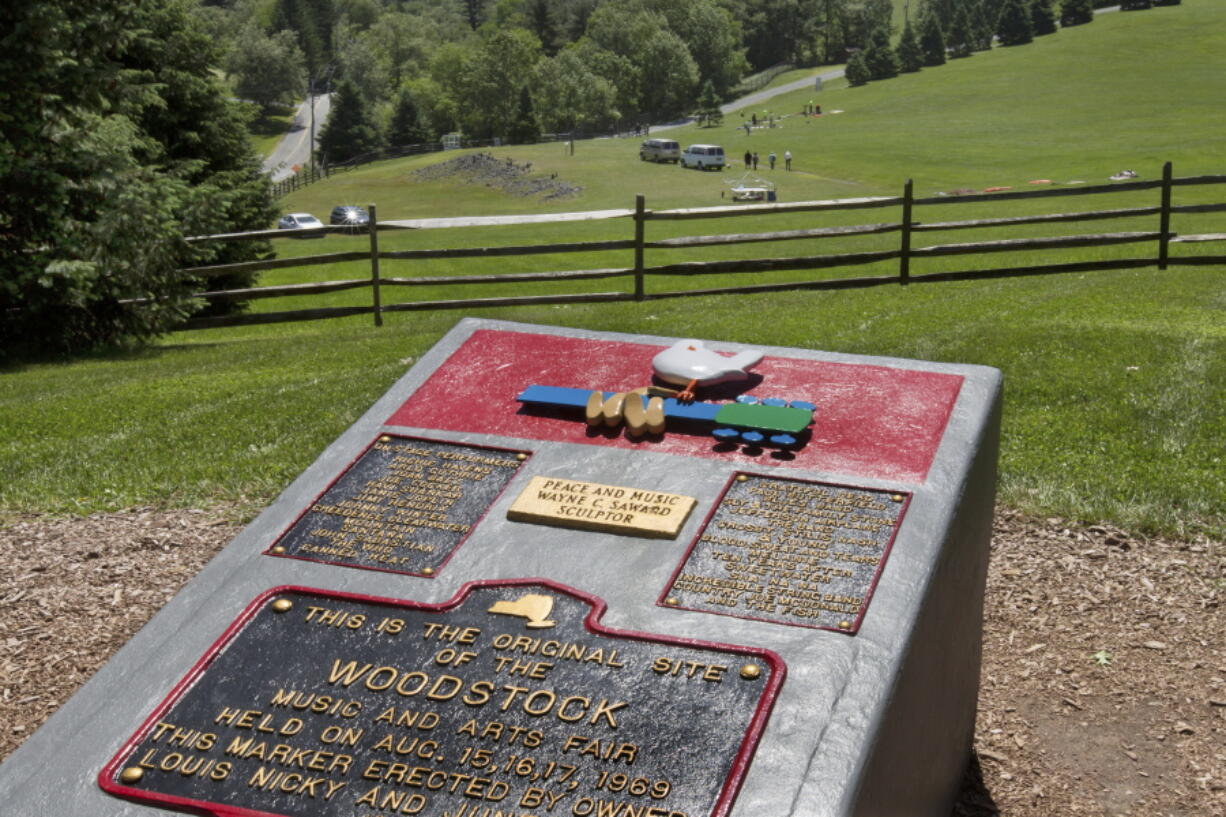 In this June 14, 2018 photo, members of the Public Archaeology Facility at Binghamton University work at the site of the 1969 original Woodstock Music and Art Fair, in Bethel, N.Y. Information from the dig will help a museum plan interpretive walking routes in time for the concert’s 50th anniversary next year.