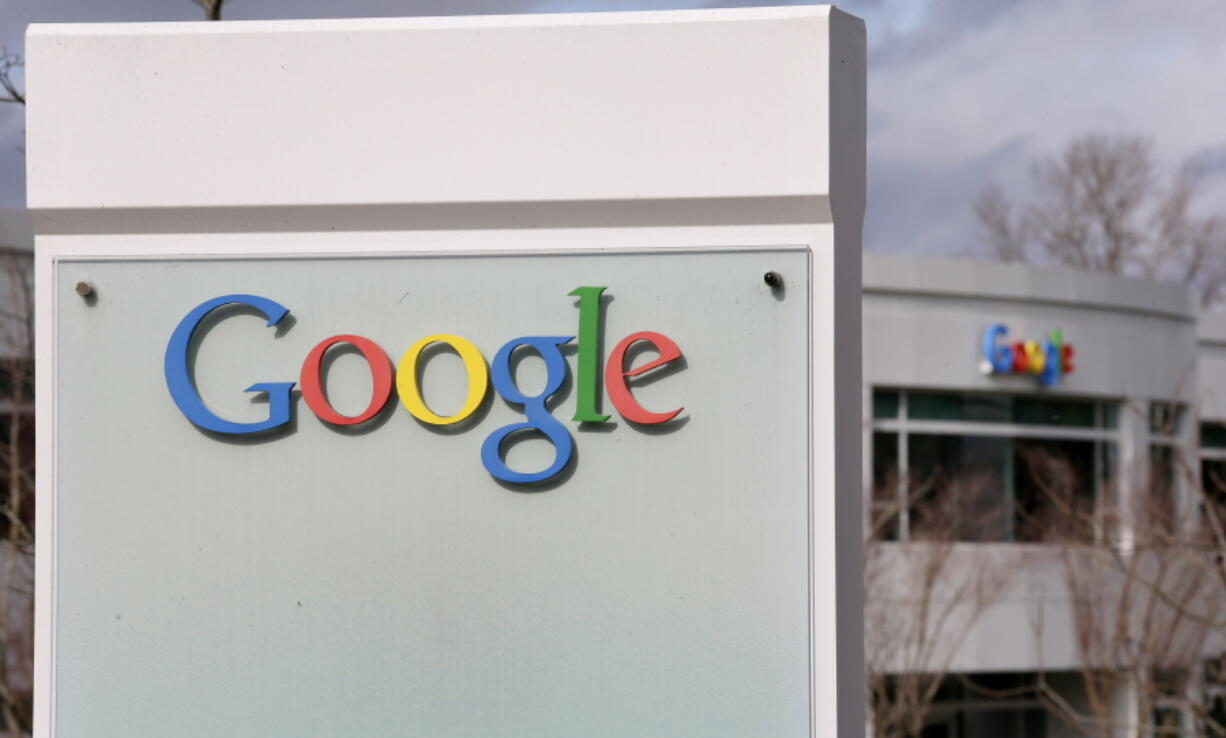 Signs for Google are seen on its campus during an opening for a new building in Kirkland on Feb. 16, 2016. Google has stopped accepting political ads in Washington on the same day changes to the state’s campaign-finance reporting requirements and enforcement procedures take effect.