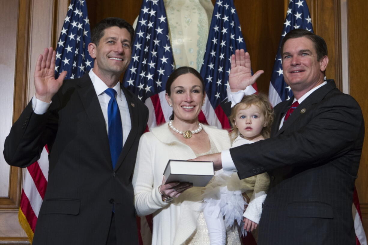 House Speaker Paul Ryan of Wis. administers the House oath of office Jan. 3, 2017 to Rep. Austin Scott, R-Ga., during a mock swearing in ceremony on Capitol Hill in Washington.