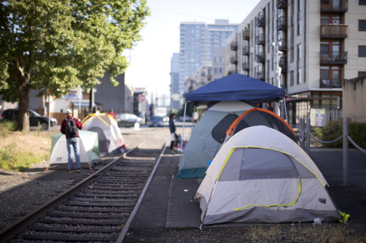 A small group of protesters has set up camp outside the Portland, Oregon headquarters of the U.S. Immigration and Customs Enforcement to protest the Trump administration’s policy of separating families after illegal border crossings. About two dozen protesters gathered Tuesday, June 17, 2018, for a round-the-clock vigil and vowed not to leave until the policy was changed.