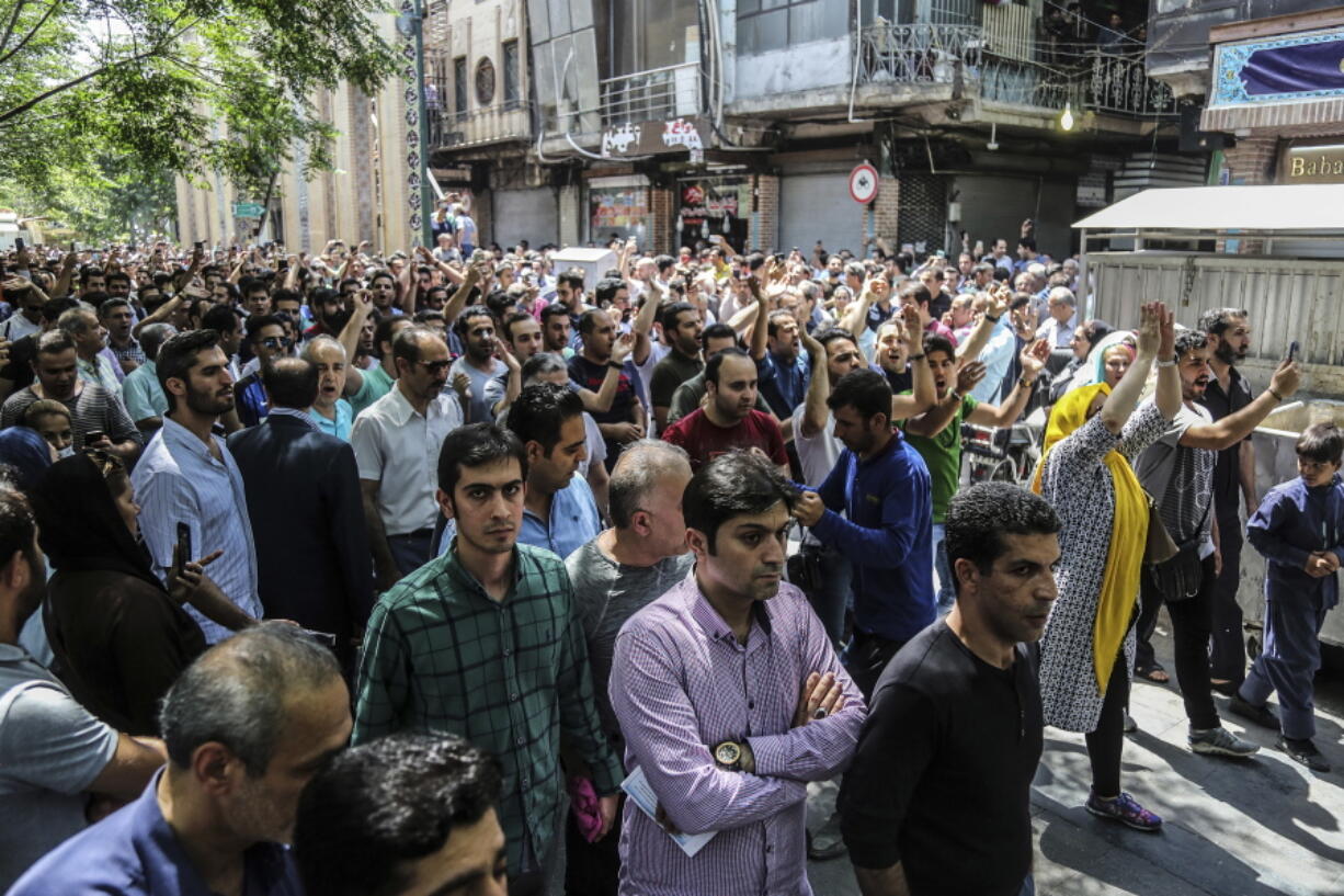 A group of protesters chant slogans at the old grand bazaar in Tehran, Iran, Monday, June 25, 2018. Protesters in the Iranian capital swarmed its historic Grand Bazaar on Monday, news agencies reported, and forced shopkeepers to close their stalls in apparent anger over the Islamic Republic’s troubled economy, months after similar demonstrations rocked the country.