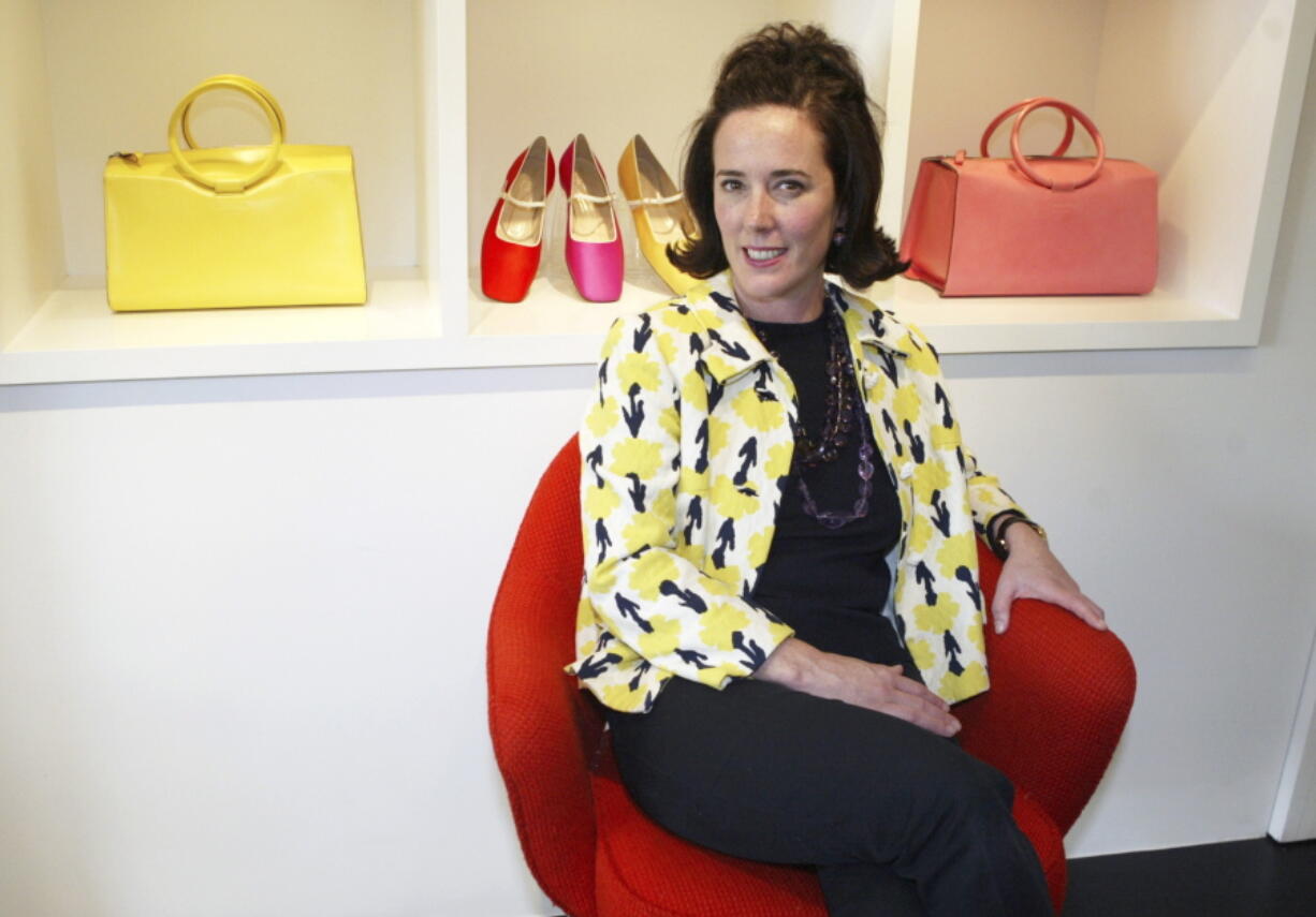 Designer Kate Spade sits during an interview in New York. Kate Spade New York has announced plans to donate $1 million to support suicide prevention and mental health awareness causes in tribute to the company’s late founder. The 55-year-old fashion designer killed herself June 5, 2018. Her husband says she suffered from depression and anxiety for many years.