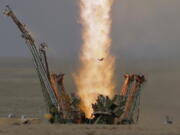 A bird flies in front of the trail of the Soyuz-FG rocket booster with Soyuz MS-09 space ship, carrying a new crew to the International Space Station, ISS, as it blasts off at the Russian leased Baikonur cosmodrome, Kazakhstan, on Wednesday. The Russian rocket carries U.S. astronaut Serena Aunon-Chancellor, Russian cosmonaut Sergey Prokopyev, and German astronaut Alexander Gerst.