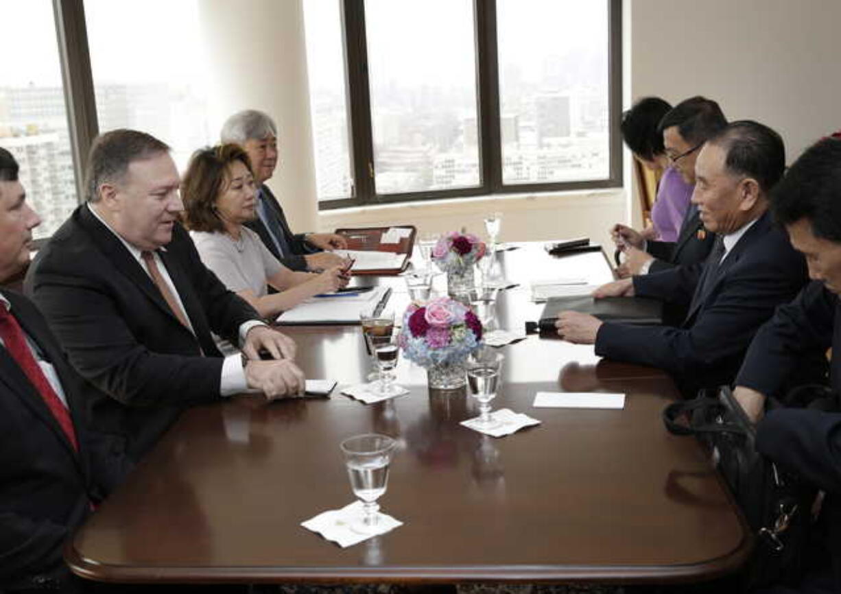 Kim Yong Chol, former North Korean military intelligence chief and one of Kim Jong Un's closest aides, second from right, and U.S. Secretary of State Mike Pompeo, second from left, sit across from one another before the start of a meeting, Thursday, May 31, 2018, in New York.