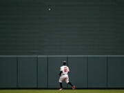 Baltimore Orioles center fielder Adam Jones watches a a solo home run Seattle Mariners' Ryon Healy during the second inning of a baseball game Wednesday, June 27, 2018, in Baltimore.