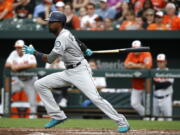 Seattle Mariners’ Dee Gordon singles in the second inning of a baseball game against the Baltimore Orioles, Monday, June 25, 2018, in Baltimore. Denard Span and Chris Herrmann scored on the play.