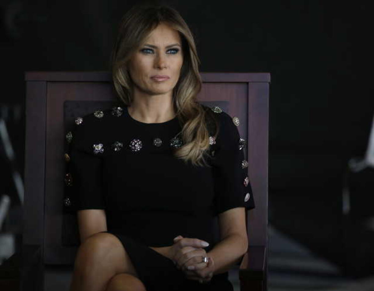 In this Saturday, May 27, 2017, file photo, first lady Melania Trump sits as President Donald Trump addresses U.S. military troops and their families at the Sigonella Naval Air Station, in Sigonella, Italy. Melania Trump won’t be joining her husband at the 2018 G7 summit in Quebec or accompanying him to the meeting planned with North Korea’s leader in Singapore following the G7.