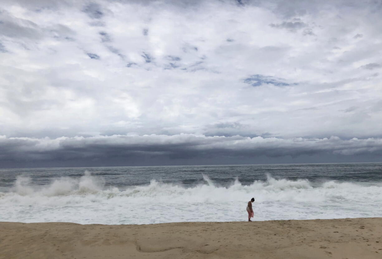 Waves crash on the beach Wednesday in San Jose del Cabo, Mexico, before the arrival of Tropical Storm Bud.