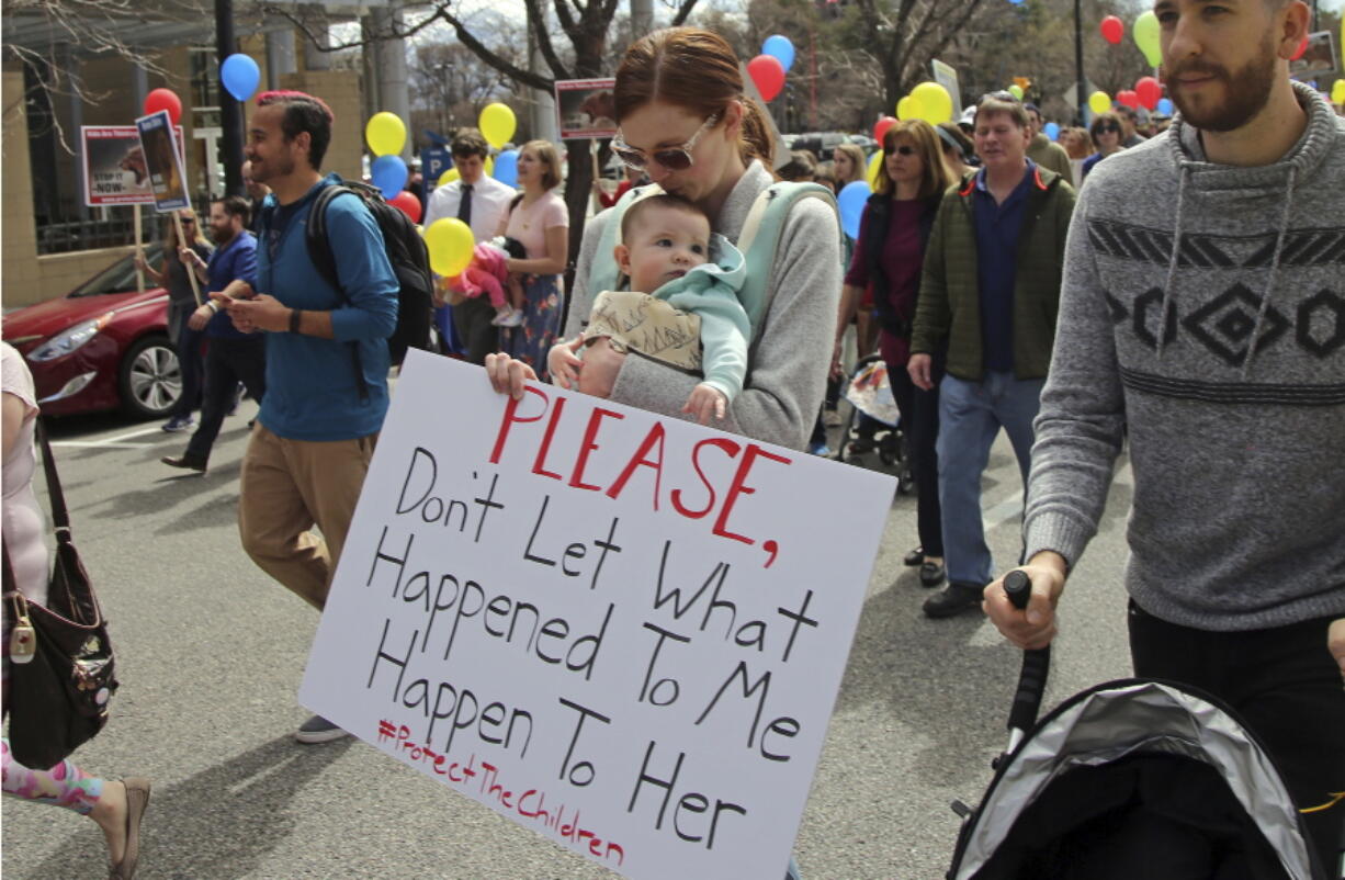 About 1,000 Mormons and former Mormons march March 30, to the church’s headquarters in Salt Lake City, to deliver petitions demanding an end to one-on-one interviews between Mormon youth and lay leaders and the sexual questions that sometimes arise during the meetings.