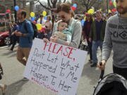 About 1,000 Mormons and former Mormons march March 30, to the church’s headquarters in Salt Lake City, to deliver petitions demanding an end to one-on-one interviews between Mormon youth and lay leaders and the sexual questions that sometimes arise during the meetings.