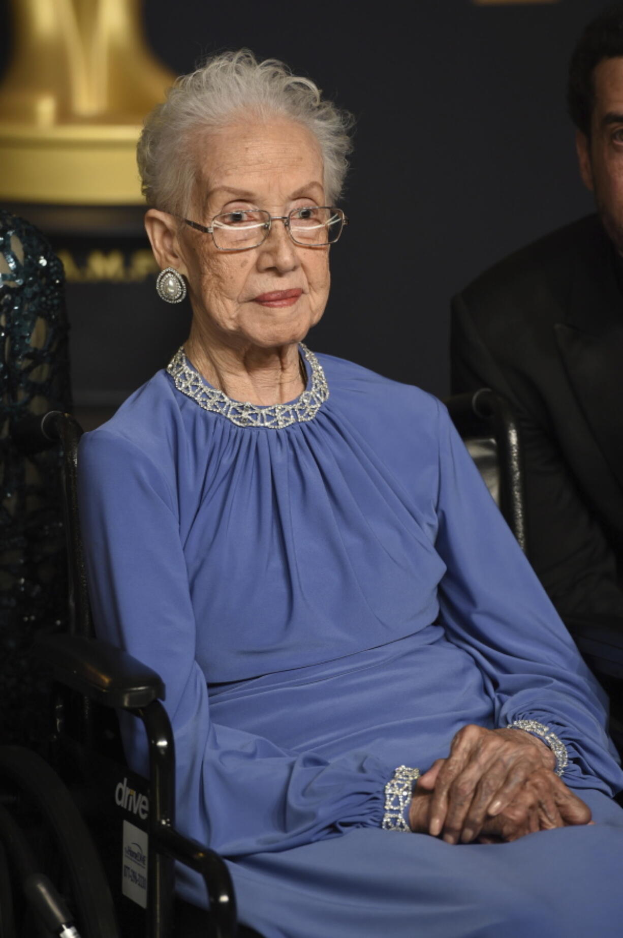 Katherine Johnson, the inspiration for the film, “Hidden Figures,” poses in the press room at the Oscars at the Dolby Theatre in Los Angeles. Johnson, the NASA mathematician whose calculations helped bring Apollo astronauts back to Earth, is being honored at her alma mater with a bronze statue and a scholarship in her time. West Virginia State University says a dedication ceremony is planned for Aug. 25, 2018, the day before Johnson’s 100th birthday.