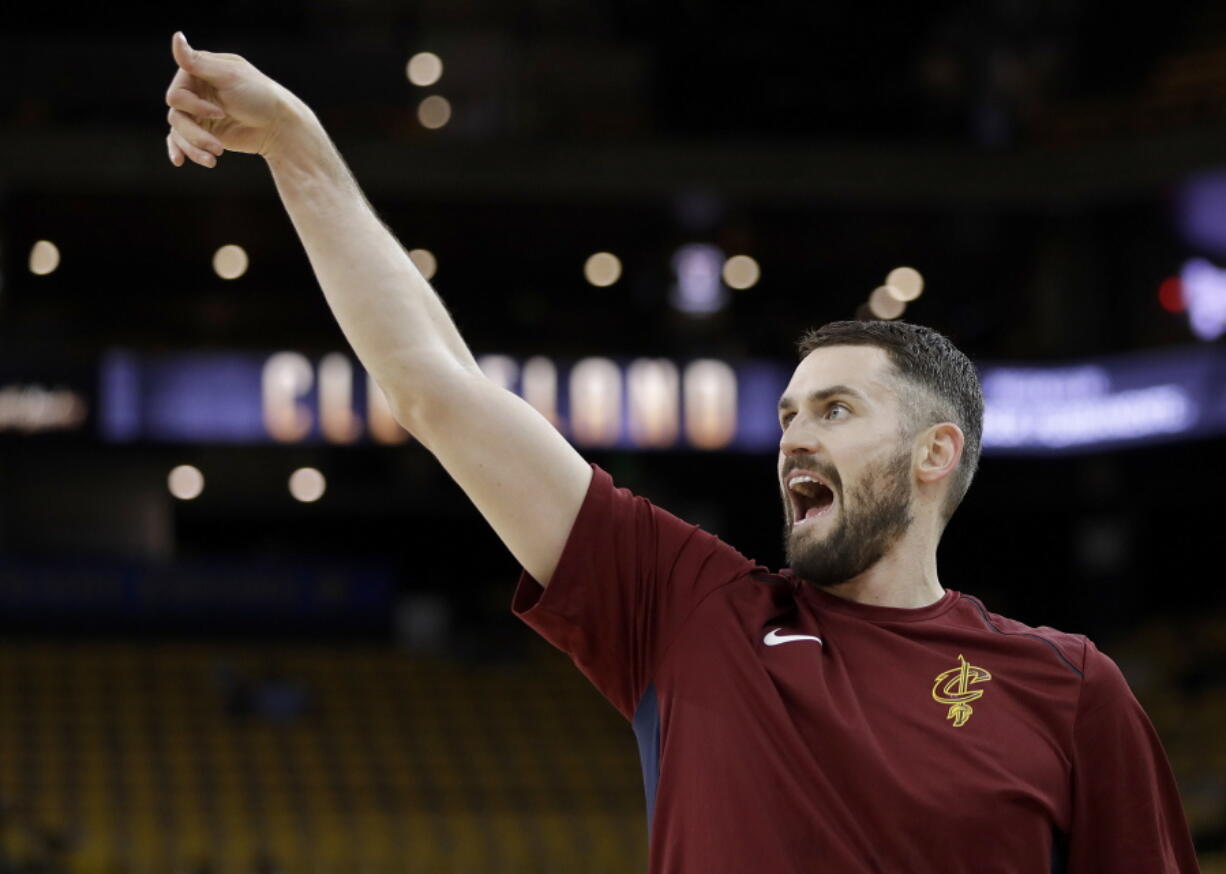 Cleveland Cavaliers forward Kevin Love warms up before Game 1 of basketball’s NBA Finals between the Golden State Warriors and the Cavaliers in Oakland, Calif., Thursday, May 31, 2018.