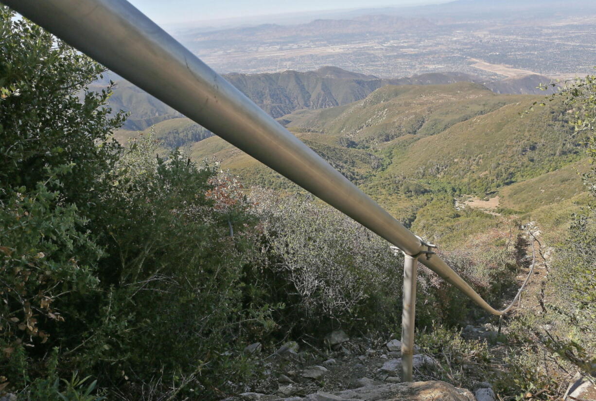 A pipeline carries water drawn from wells July 13, 2015, in the San Bernardino National Forest, Calif. Nestle has been offered a three-year permit to keep taking millions of gallons of water from Southern California’s San Bernardino National Forest, but with new restrictions designed to keep a creek flowing for other uses.