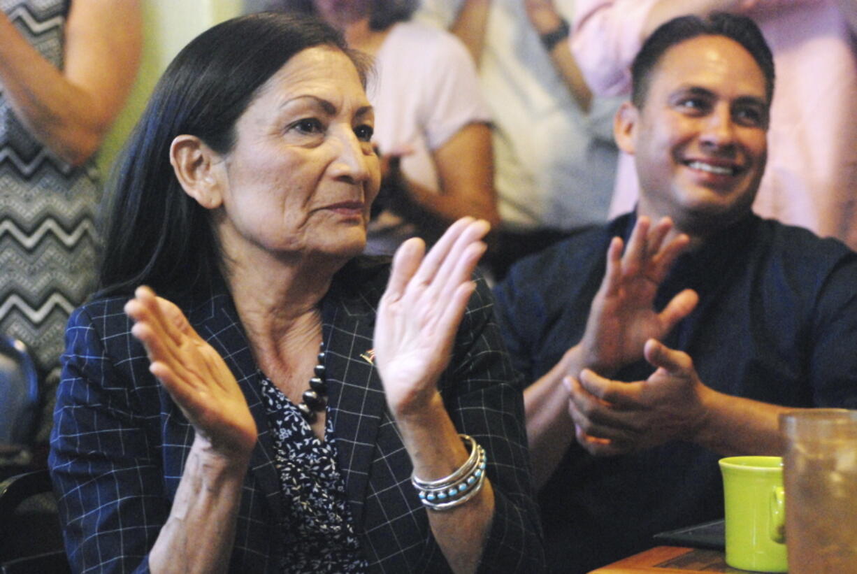 New Mexico’s Democratic nominee to U.S. Congress, Debra Haaland, left, applauds at a celebratory breakfast in Albuquerque, N.M., on Wednesday alongside state Sen. Howie Morales, who was nominated to run for lieutenant governor in the fall general election. Haaland is trying to become the first Native American woman to serve in the House of Representatives.