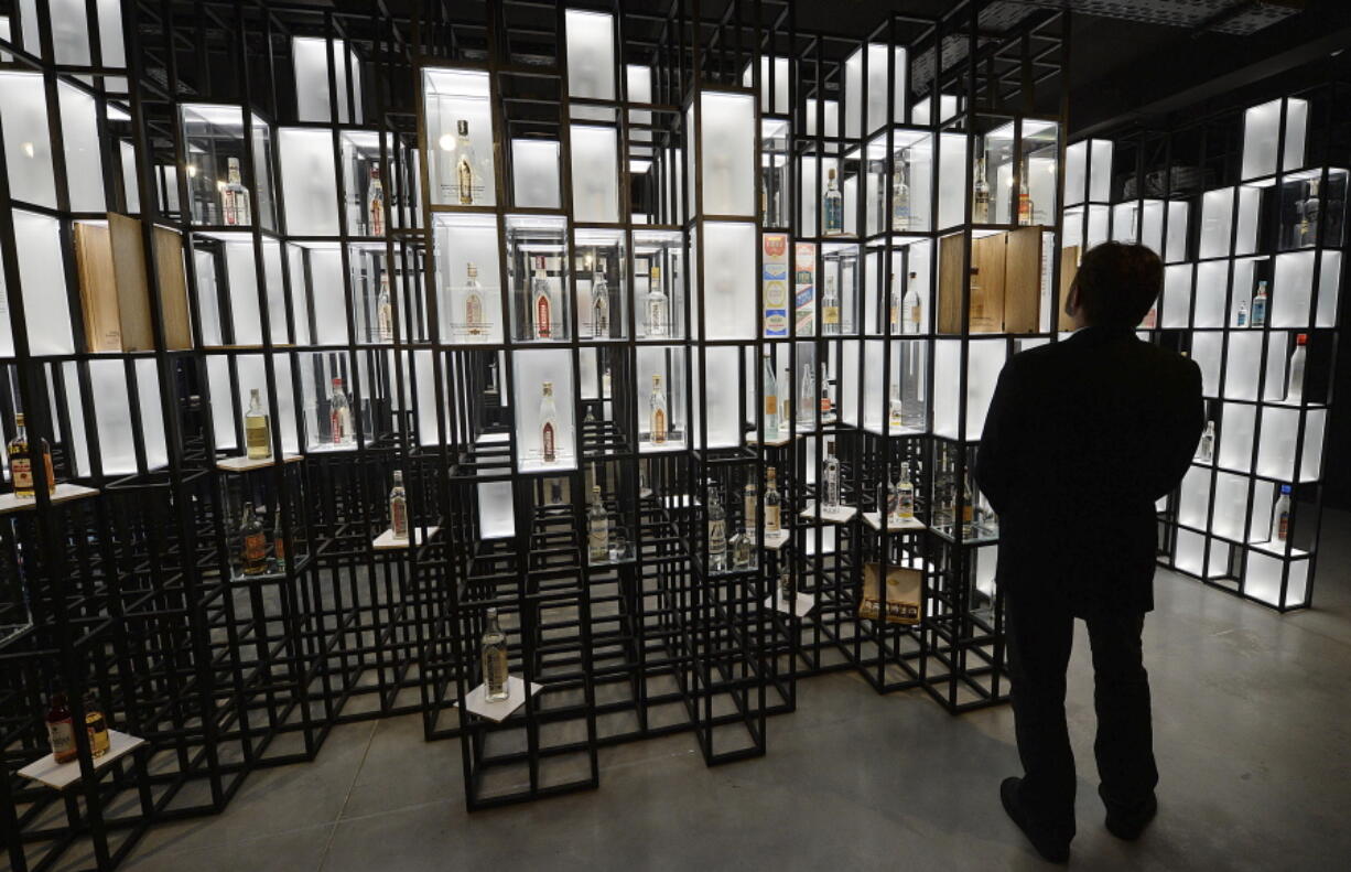 A visitor examines a display at the Polish Vodka Museum, a new museum that will open next week, in Warsaw, Poland, Wednesday, June 6, 2018. The museum is devoted solely to Polish vodka, a national tradition of more than 500 years and one of the country’s best-known exports.