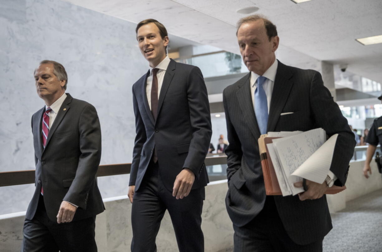 James A. Wolfe, left, the longtime director of security for the Senate intelligence committee, walks with Jared Kushner, center, President Donald Trump’s son-in-law and Senior White House adviser, as he leaves Capitol Hill after a closed-door interview with Senate Intelligence Committee investigators. Abbe Lowell, a well-known Washington criminal defense attorney, right. Prosecutors are accusing Wolfe of lying to the FBI about contact he had with reporters. (AP Photo/J.