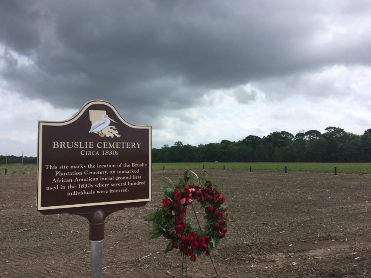 In this taken March 28., 2018 photo, shows the Bruslie Cemetery, a burial ground for slaves in New Orleans. The Shell Oil Company has spruced up, marked and blocked off tracts of its land in the Convent community west of New Orleans where archaeologists confirmed the presence of slave burial grounds in 2013.