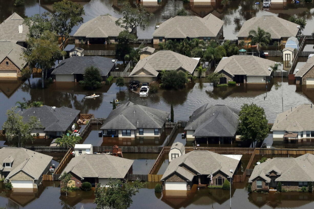 Homes are surrounded by water from the flooded Brazos River in the aftermath of Hurricane Harvey in Freeport, Texas, in September.