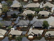 Homes are surrounded by water from the flooded Brazos River in the aftermath of Hurricane Harvey in Freeport, Texas, in September.