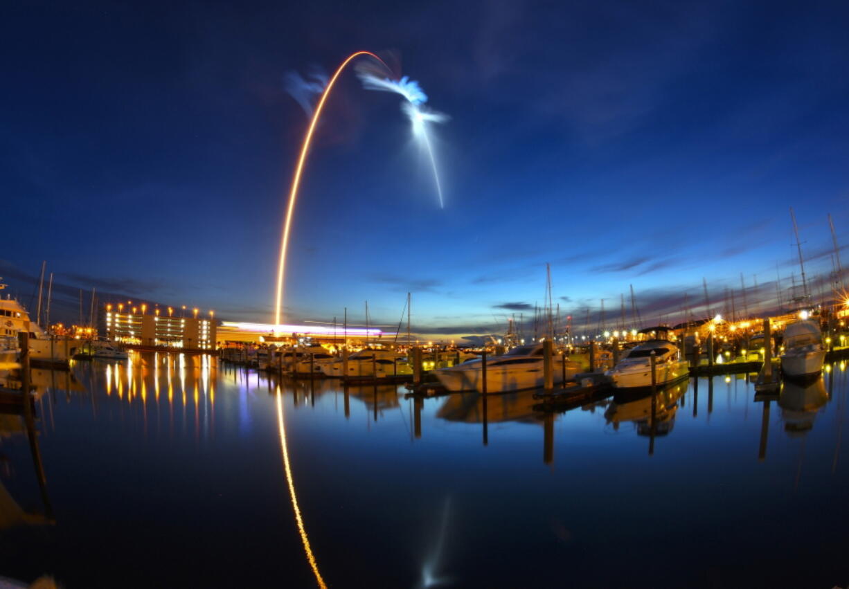 A SpaceX Falcon 9 rocket’s exhaust plume is illuminated during a launch just before dawn Friday at Launch Complex 40 at Cape Canaveral, Fla.