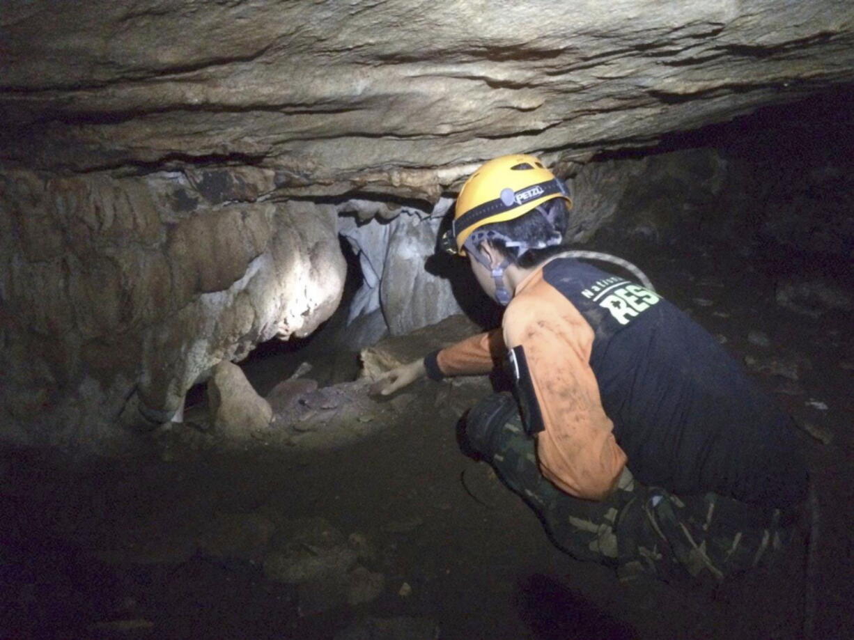 Rescue personnel search for alternate entrances to a cave where 12 boys of a soccer team and their coach went missing in Mae Sai, Chiang Rai, northern Thailand. Rain is continuing to fall and water levels keep rising inside a cave in northern Thailand, frustrating the search for the boys and their coach who have been missing since Saturday.