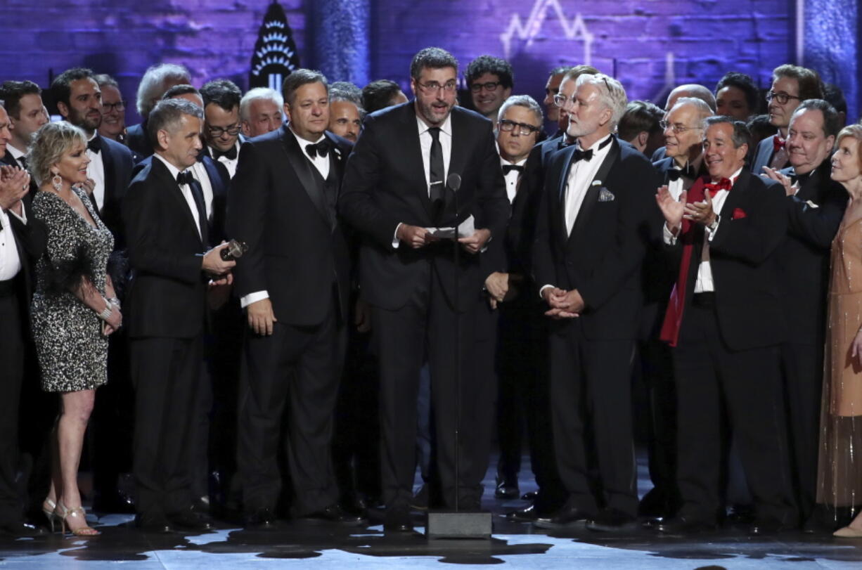 Orin Wolf, center, and the cast and crew of "The Band's Visit" accept the award for best musical at the 72nd annual Tony Awards at Radio City Music Hall on Sunday, June 10, 2018, in New York.