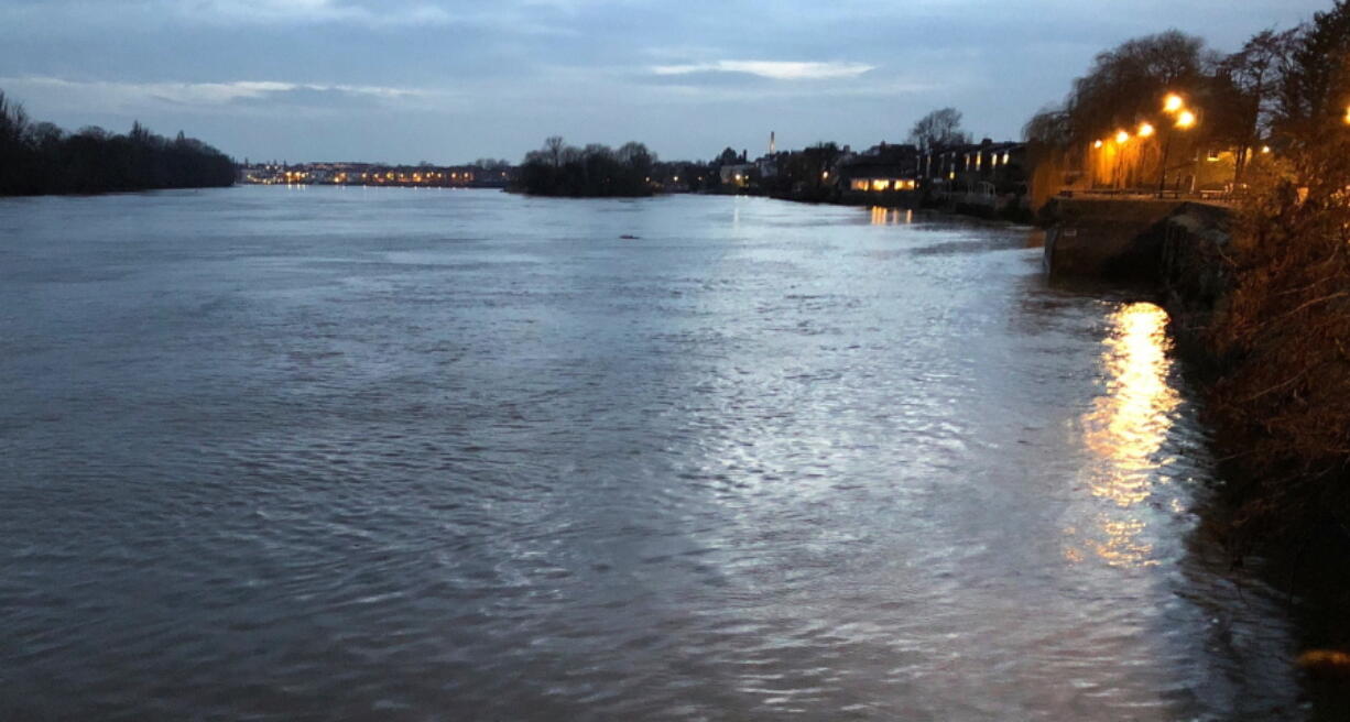 This March 2018 photo shows a late-day view of the Thames River as seen from Hammersmith, a district of west London. Visitors to London looking to save money might consider lodging in areas like Hammersmith, away from central London. Just make sure you’re not too far from public transportation.