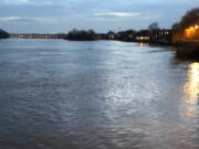 This March 2018 photo shows a late-day view of the Thames River as seen from Hammersmith, a district of west London. Visitors to London looking to save money might consider lodging in areas like Hammersmith, away from central London. Just make sure you’re not too far from public transportation.