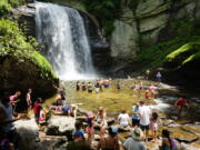 Swimmers wade in at the base of Looking Glass Falls in the Pisgah National Forest, between Brevard, N.C., and the Blue Ridge Parkway.