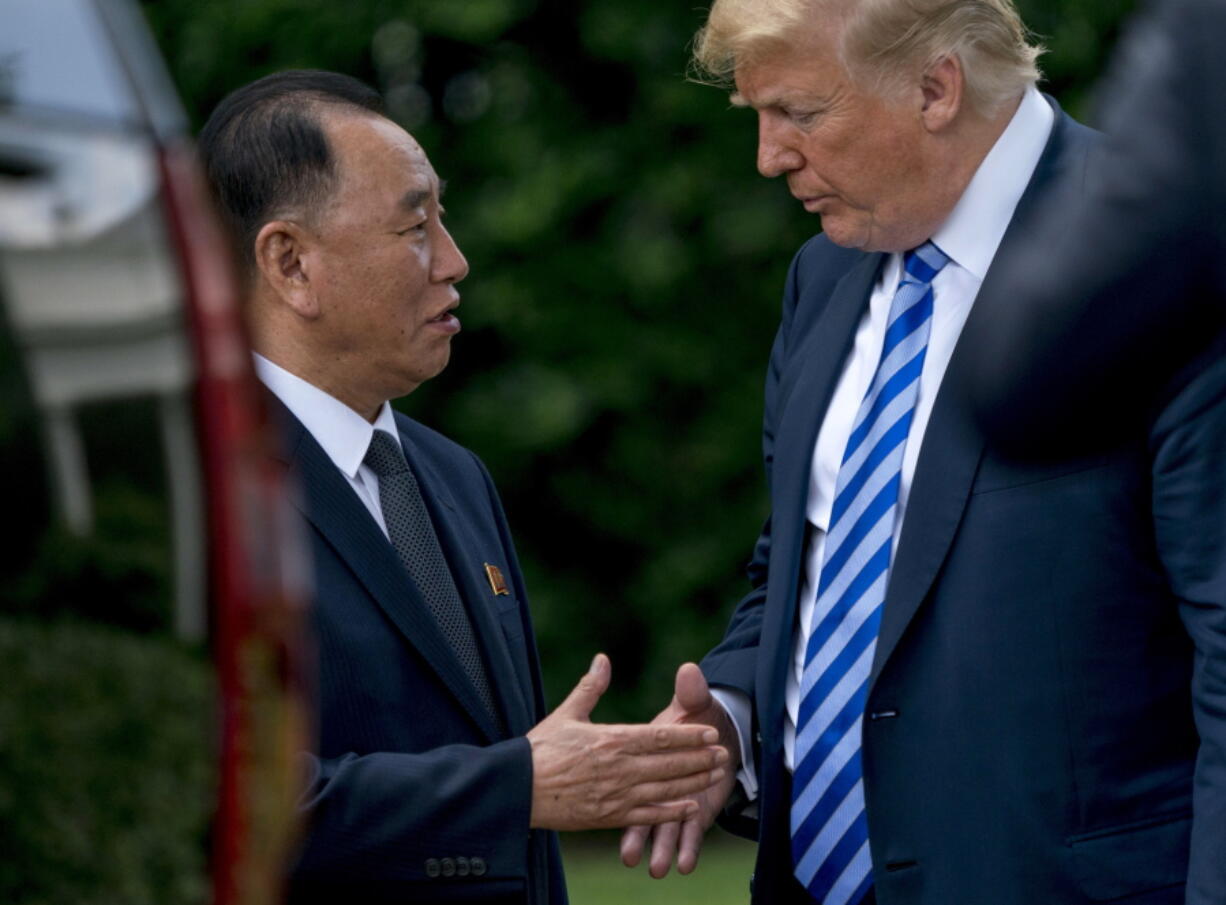 President Donald Trump shakes hands with Kim Yong Chol, former North Korean military intelligence chief and one of leader Kim Jong Un’s closest aides, as after their meeting in the Oval Office of the White House in Washington, Friday.