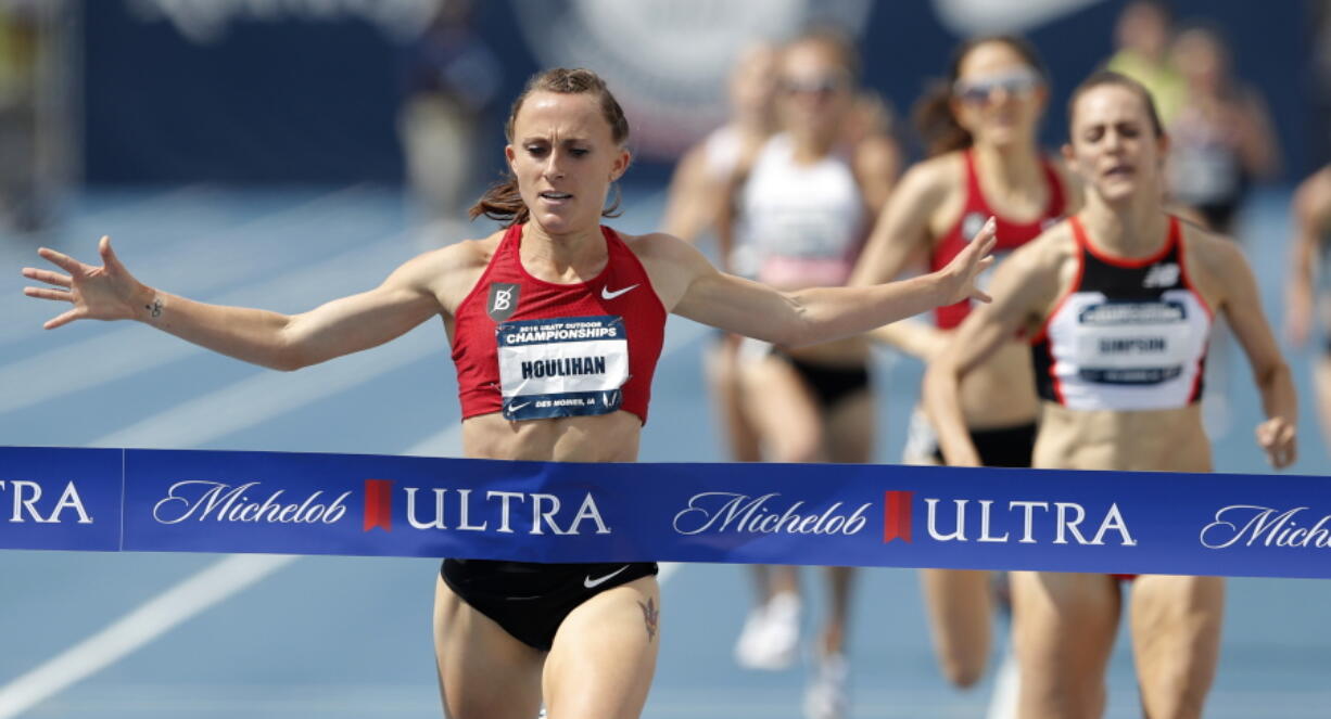 Shelby Houlihan celebrates as she wins the women’s 1500-meter run at the U.S. Championships athletics meet, Saturday, June 23, 2018, in Des Moines, Iowa.